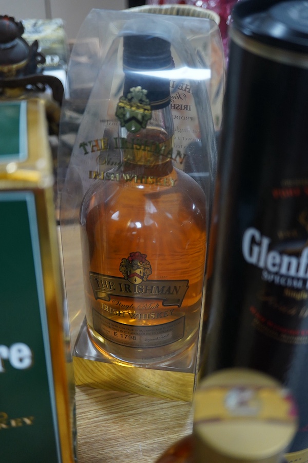 Ten bottles of Whisky including a gallon bottle of Bells. , Condition - good